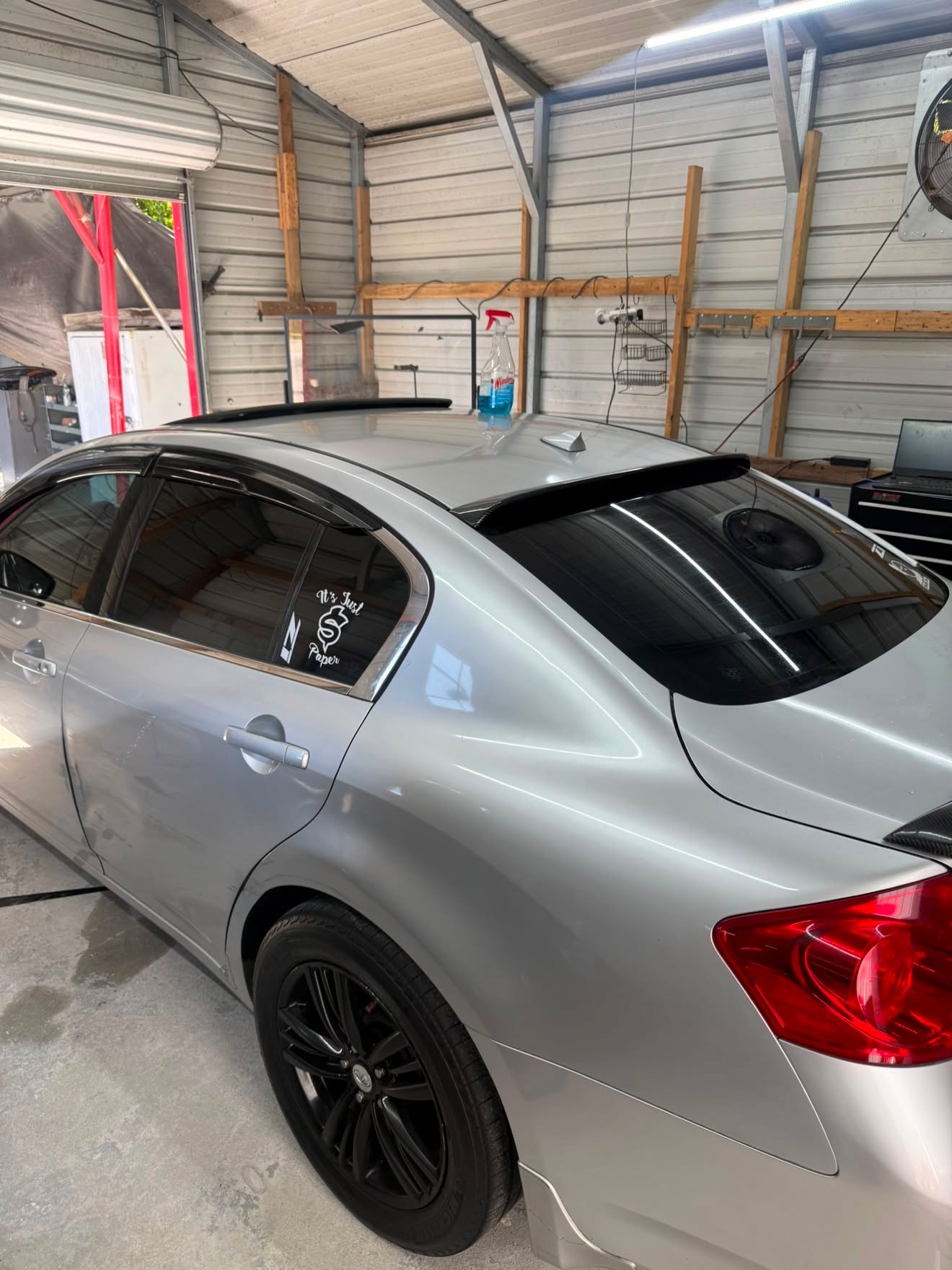 Silver Infiniti sedan with fresh window tint