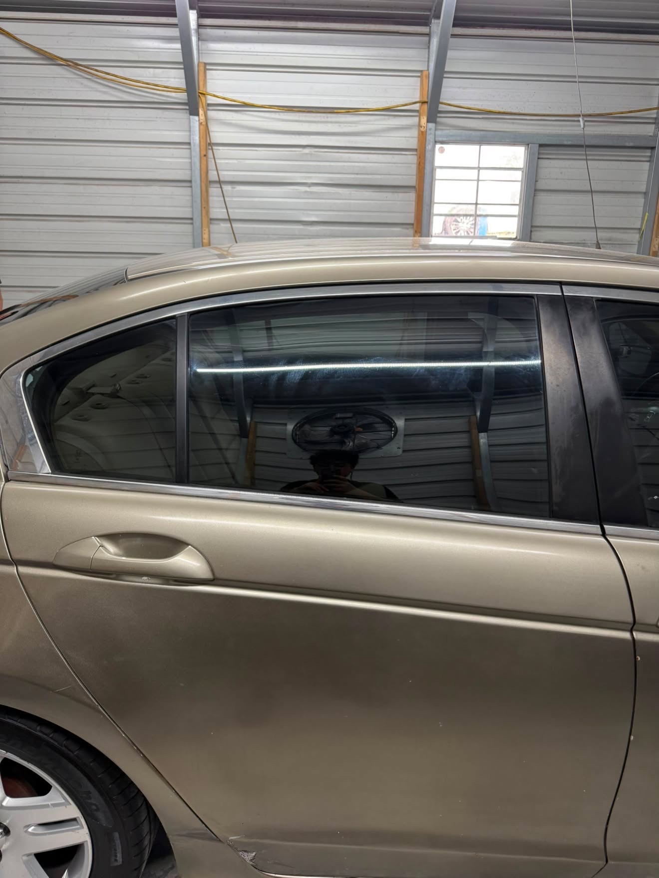 Gold Honda Accord tinted rear window