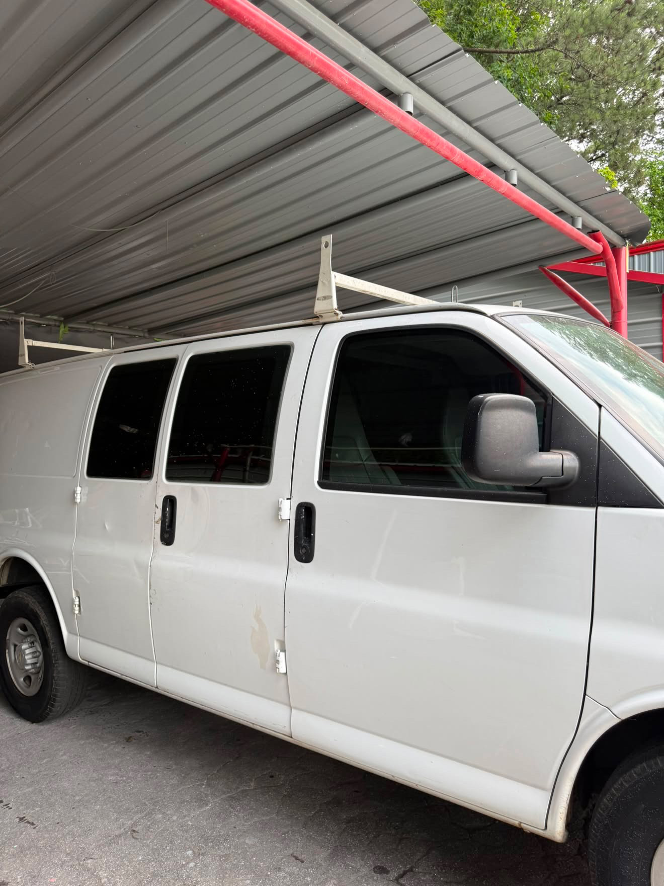 White Chevrolet Express work van tinted